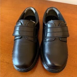 New without original box JJ school boys black shoes in size 12 wide.